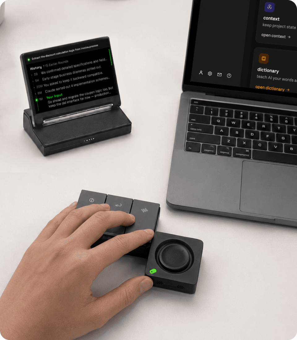 SlashVibe controller on a desk beside a laptop
